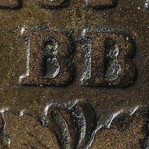 Nahaufnahme der Buchstaben BB auf einem 1814 in Straßburg geprägten Décime