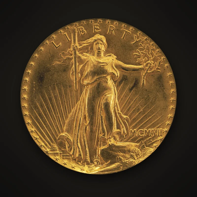 1907 Saint-Gaudens high relief $20 gold coin, obverse: Liberty striding forward with a torch and olive branch, in front of the sun and the Capitol