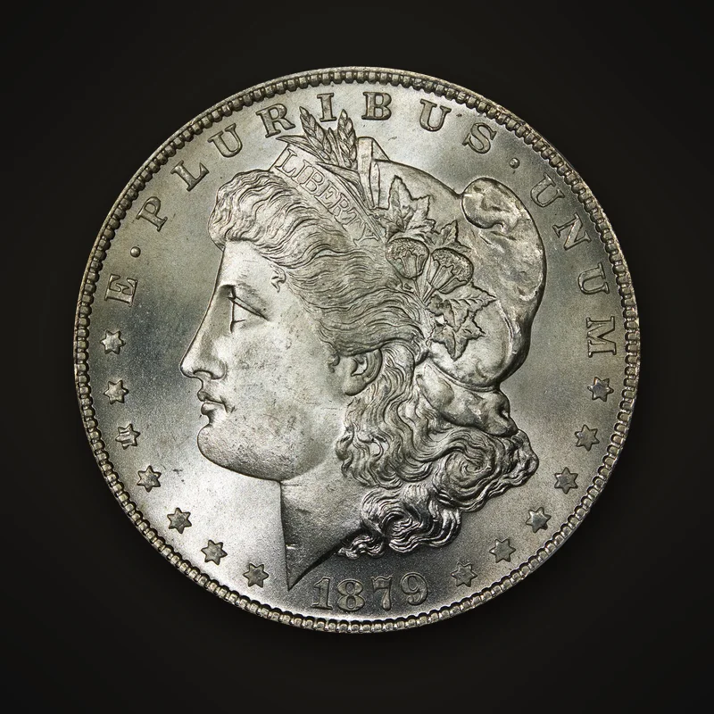 1879 silver Morgan Dollar struck in San Francisco, obverse: head of Liberty wearing a Phrygian cap